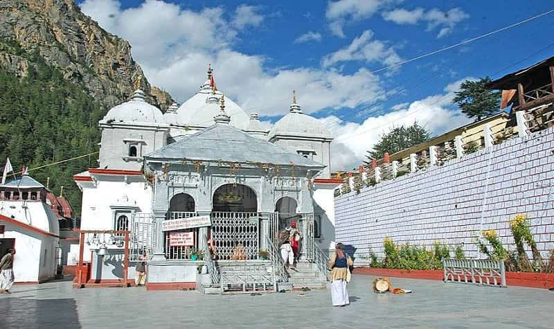 The front sacred view of Gangotri dham adorned with white beauty & looks serene on the lap of mountains